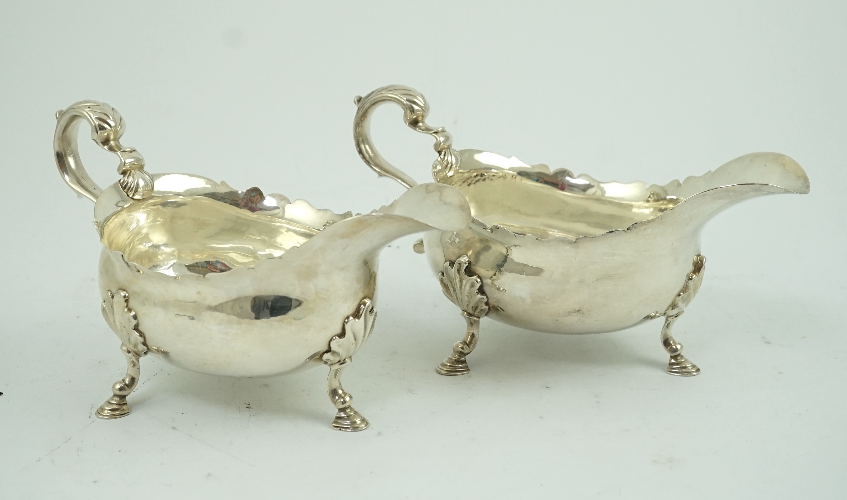 A pair of late George II silver sauceboats by Robert Albin Cox